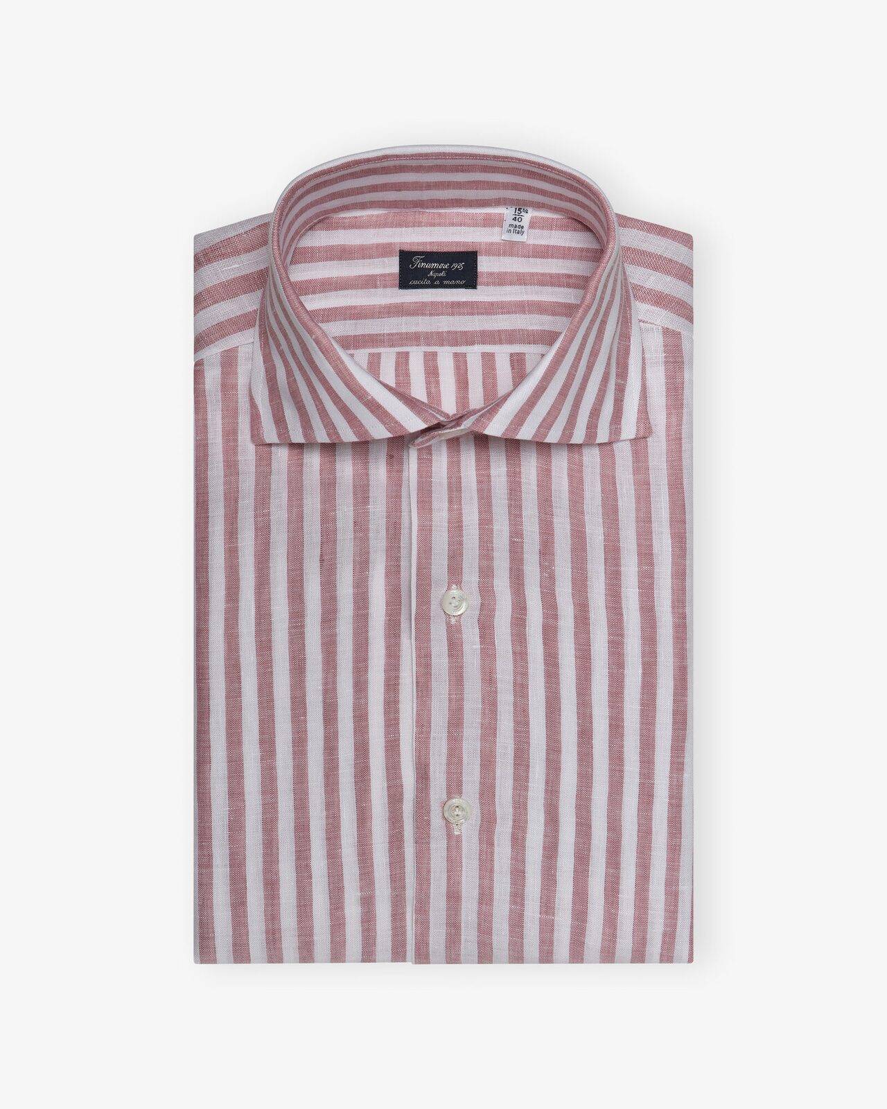 Les Hommes d'Amsterdam — Folded striped shirt on white