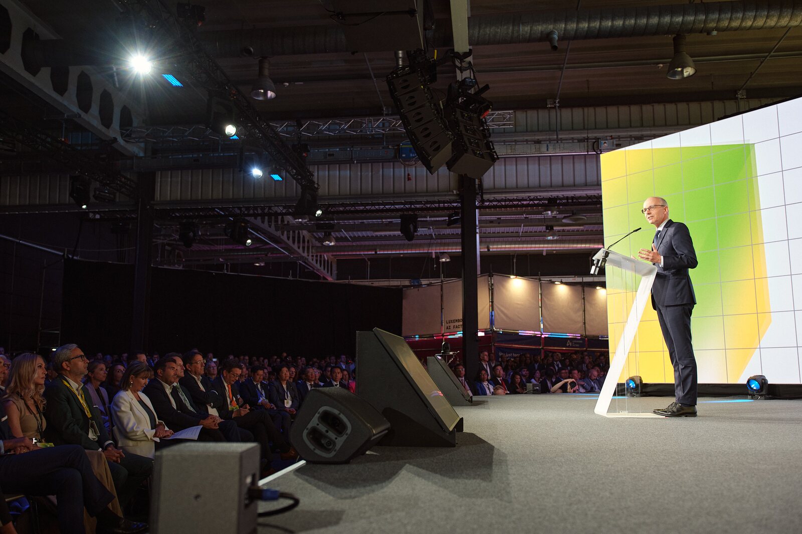 Paperjam — Opening ceremony: the Prime Minister of Luxembourg on stage before a full hall