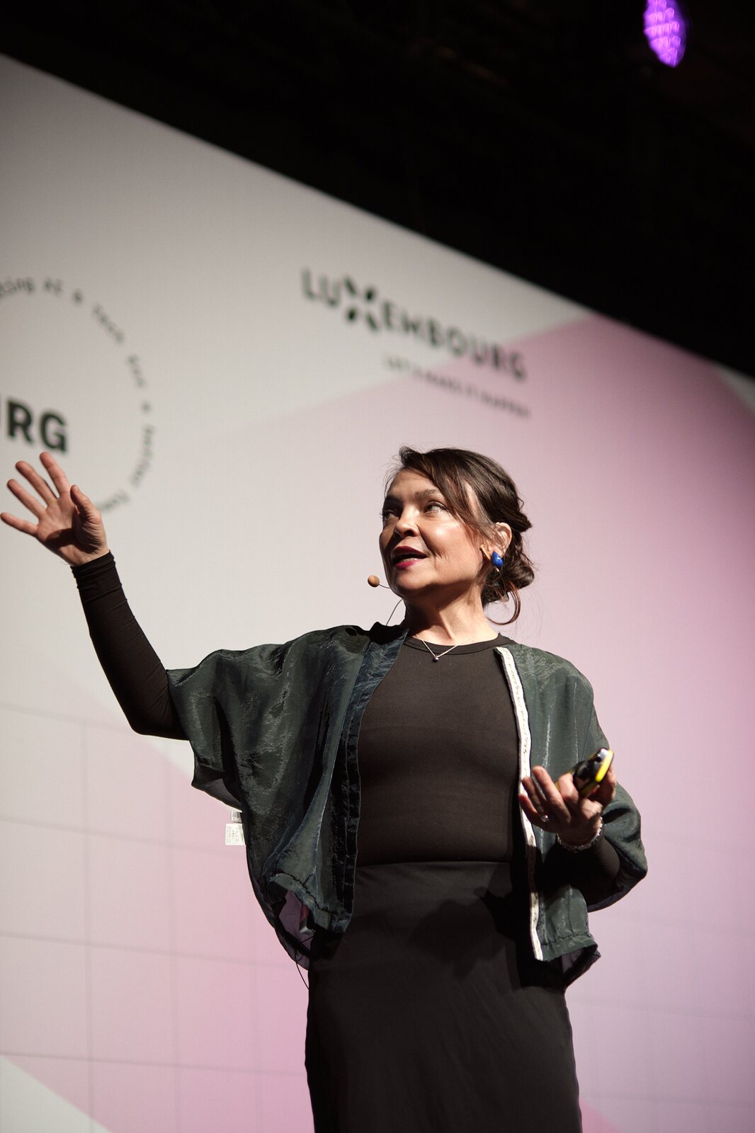 Paperjam — Speaker mid-gesture on stage