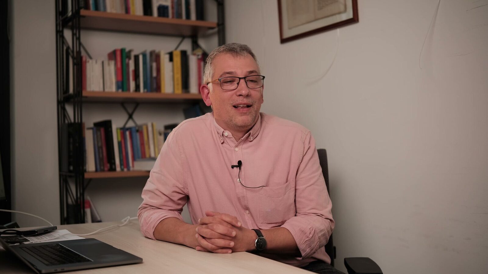 University of Luxembourg — Still from an interview film: seated interview in an office with bookshelves